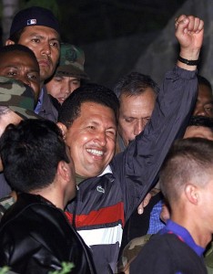 enezuelan President Hugo Chavez (C) salutes on arrival at the Miraflores palace April 14, 2002. ©REUTERS