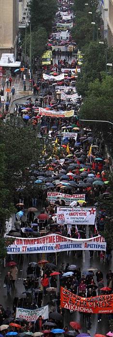 Up to 7,000 protesters march in the streets of Athens today, protesting the Greek government?s plan to ease its debt crisis by freezing public sector wages. Photo: AP)