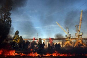 Strikers block fuel storage depots to protest against pension reform, on October 18, 2010 in Caen, northwestern France. The two main Normand depots, run by the Combustibles de Normandie company in Caen and by Total in Ouistreham are blocked by several dozens of opponents to the French government pensions reform. More than 1,000 petrol stations located on the forecourts of French supermarkets had run out of fuel today amid strikes against pension reform, their industry association told AFP.  (Photo: Kenzo Tribouillard / AFP / Getty Images)