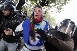 Police arrested a young man during a demonstration in Lyon. (Photo: AP / Laurent Cipriani)