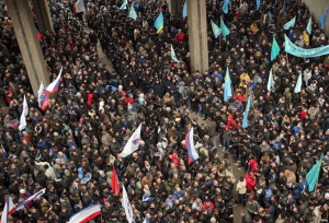 Pro-Russian activists and Crimean Tatar protesters and supporters of Euromaidan stand opposite each other near the Parliament building in Simferopol, Crimea, 26 February 2014