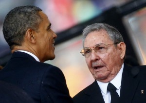 President Obama greets Cuba’s President Raul Castro before giving a speech at the memorial service for late South African President Nelson Mandela in Johannesburg on Dec. 10, 2013 (Photo: Kai Pfaffenbach / Reuters)