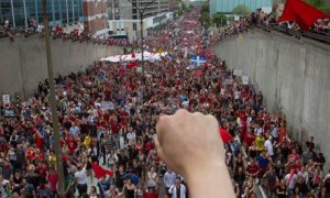 Thousands of demonstrators march to mark the 100th day of a student strike against tuition hikes in Montreal, Quebec, 22 May 2012. )