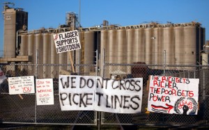 Signs are seen at the entrance of Port #5 on December 12, 2011 in Portland, Ore. Hundreds of Occupy Portland protesters effectively shut down two of the Port of Portland's busiest terminals on Monday, preventing about 200 longshore workers from going to work. (Photo: Natalie Behring/Getty Images)