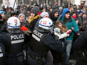 Police disperse demonstrators as students protest in Montreal against proposed austerity changes by the provincial government, Monday, March 23, 2015. (Photo: Ryan Remiorz / THE CANADIAN PRESS)