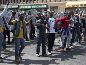 Demonstrators call for peace after a bottle is thrown at them on W. North Avenue in Baltimore, Maryland, April 28, 2015. (Photo: Jim Watson / AFP / Getty Images)