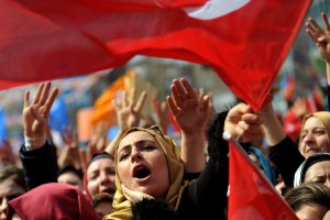 Supporters of Turkey's Justice and Development Party wave AKP flags as at a rally in Istanbul on March 29. (Photo: Agence France-Presse / Getty Images)