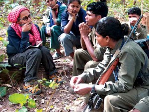 Roy with Gondi Maoists (Photo: outlookindia.org)