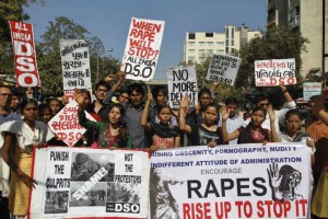 Members of All India Democratic Students Organization (DSO) hold placards and shout slogans condemning the brutal gang-rape of a woman on a moving bus in New Delhi during a protest in Ahmadabad, India, in December, 2012. (Photo: Ajit Solanki / AP)