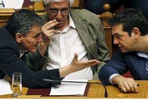 Greek Prime Minister Alexis Tsipras, right, listens to Finance Minister Euclid Tsakalotos as Justice Minister Nikos Paraskevopoulos, center, watches during a parliamentary session in Athens on July 23. (Photo: Reuters)