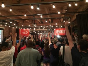 Hands go up as Kshama asks - Are you ready to knock on 80,000 doors?