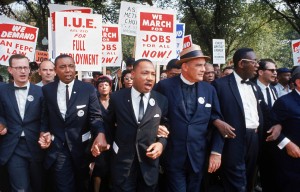 Leaders of March on Washington for Jobs & Freedom marching with signs (R-L): Rabbi Joachim Prinz, [unidentified], Eugene Carson Blake, Martin Luther King, Floyd McKissick, Matthew Ahmann & John Lewis. (Photo: Robert W. Kelley / The LIFE Picture Collection / Getty Images)