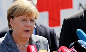 German chancellor Angela Merkel visits a refugee shelter in Heidenau (Photo: Jan Woitas / DPA / Corbis)