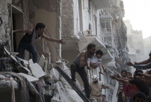 Aftermath of a "barrel bomb" attack in Aleppo, May 2015 (Photo: Karam al-Masri / AFP / Getty Images)